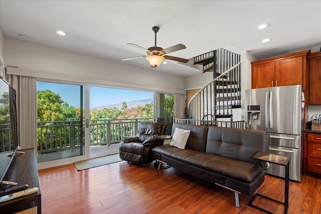 living room featuring stairway, recessed lighting, ceiling fan, and wood finished floors