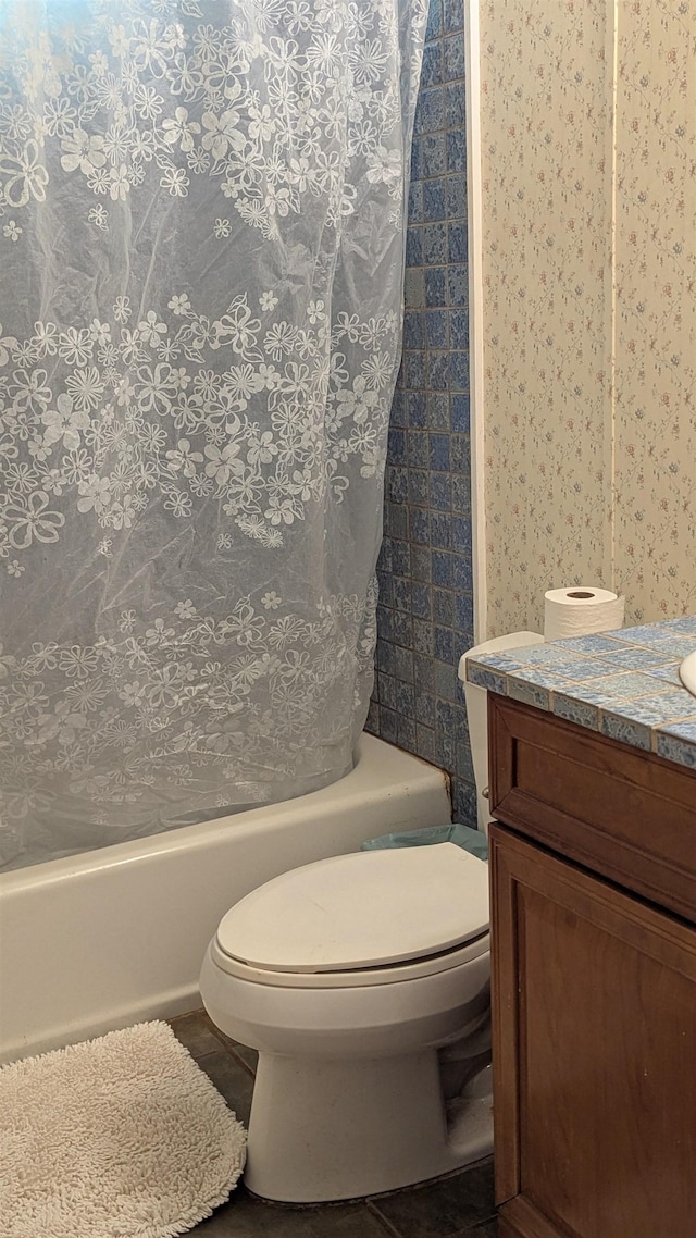 full bath with vanity, toilet, and shower / tub combo