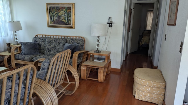 living room featuring baseboards and wood finished floors