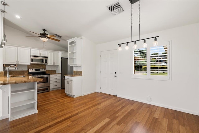 23 Poinciana Rd, Lahaina, HI 96761 - kitchen featuring open shelves, stainless steel appliances, a sink, white cabinetry, and vaulted ceiling