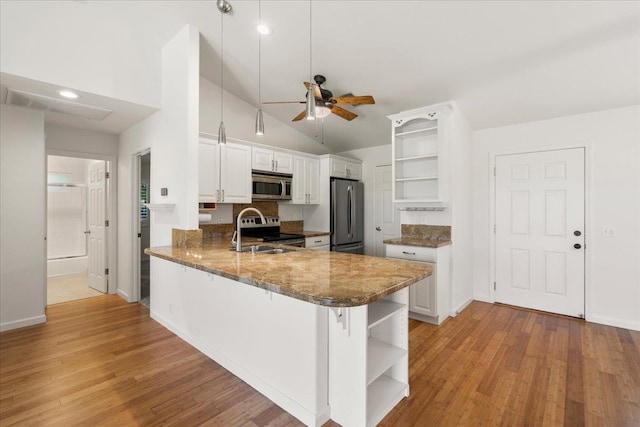 23 Poinciana Rd, Lahaina, HI 96761 - kitchen featuring open shelves, appliances with stainless steel finishes, a sink, a ceiling fan, and a peninsula