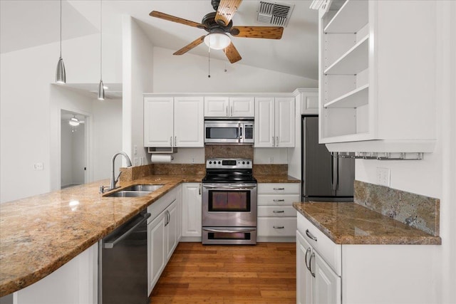 23 Poinciana Rd, Lahaina, HI 96761 - kitchen featuring stainless steel appliances, a sink, vaulted ceiling, a ceiling fan, and light wood-type flooring