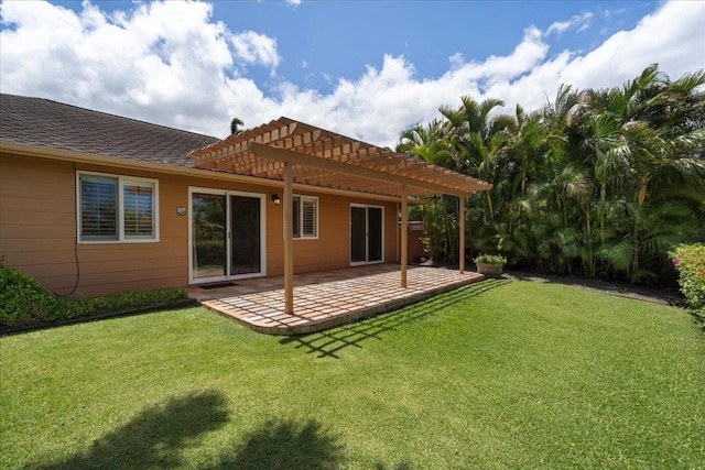 23 Poinciana Rd, Lahaina, HI 96761 - rear view of house with a pergola, a patio, a lawn, and a tile roof