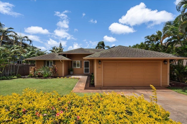 23 Poinciana Rd, Lahaina, HI 96761 - ranch-style home with an attached garage, stucco siding, and concrete driveway