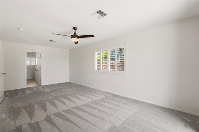 23 Poinciana Rd, Lahaina, HI 96761 - unfurnished bedroom with light carpet, baseboards, and ceiling fan