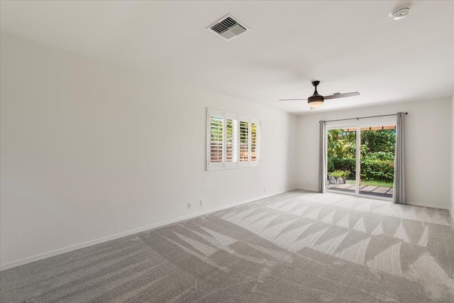 23 Poinciana Rd, Lahaina, HI 96761 - empty room with a smoke detector, light colored carpet, ceiling fan, and baseboards