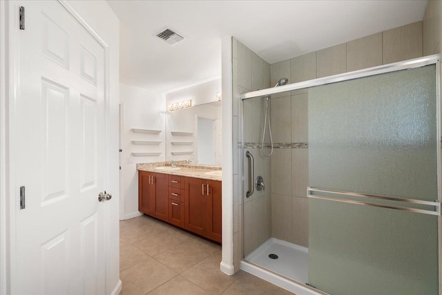 23 Poinciana Rd, Lahaina, HI 96761 - full bath with tile patterned floors, a stall shower, and double vanity
