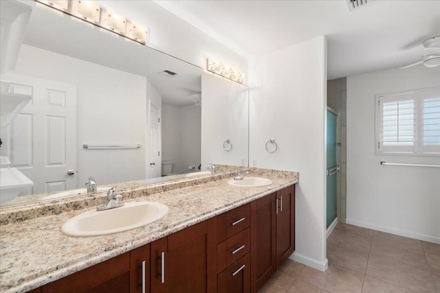 23 Poinciana Rd, Lahaina, HI 96761 - full bathroom with toilet, tile patterned flooring, a stall shower, and baseboards