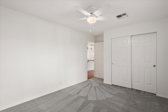 23 Poinciana Rd, Lahaina, HI 96761 - unfurnished bedroom with carpet floors, a closet, baseboards, and ceiling fan