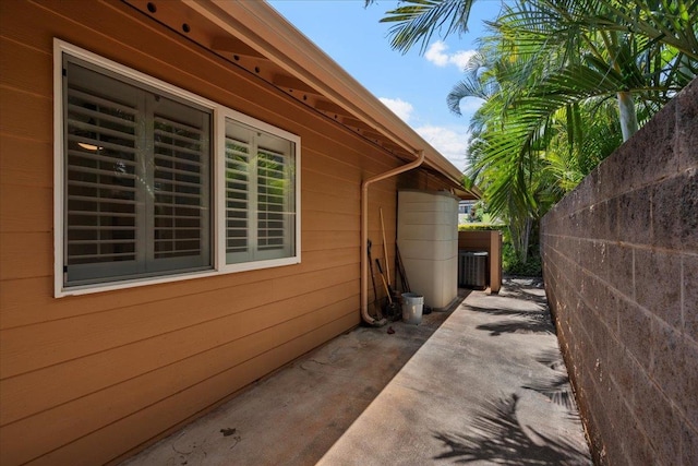 23 Poinciana Rd, Lahaina, HI 96761 - view of property exterior featuring fence, a patio, and central AC unit