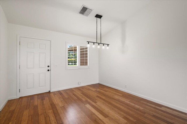 23 Poinciana Rd, Lahaina, HI 96761 - unfurnished dining area featuring baseboards and wood finished floors