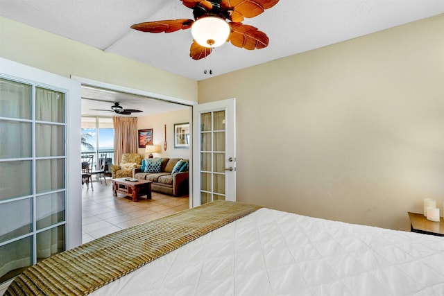 tiled bedroom featuring ceiling fan