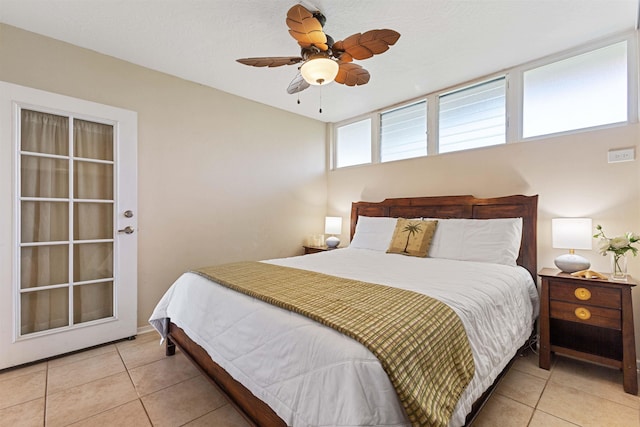 bedroom featuring light tile patterned floors and ceiling fan