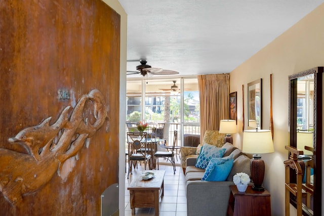 living room featuring tile patterned floors and ceiling fan