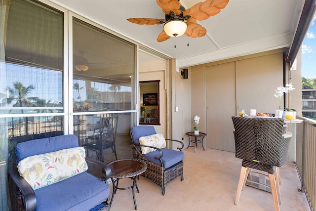 exterior space with a balcony and ceiling fan