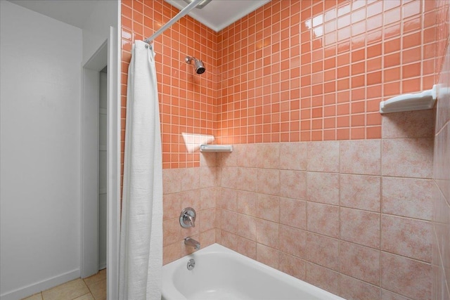 bathroom with tile patterned floors and shower / bathtub combination with curtain