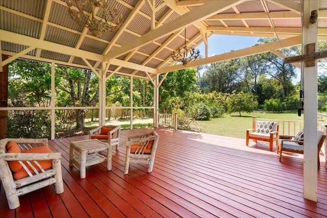 wooden deck featuring a gazebo and a yard