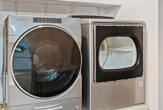 laundry room with washer and dryer and laundry area