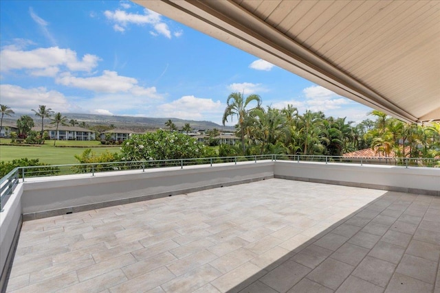 view of patio / terrace with a mountain view and a balcony