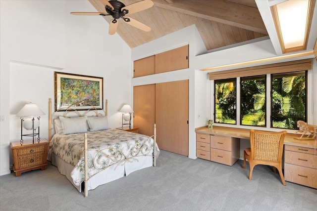 bedroom featuring ceiling fan, beamed ceiling, high vaulted ceiling, and light colored carpet