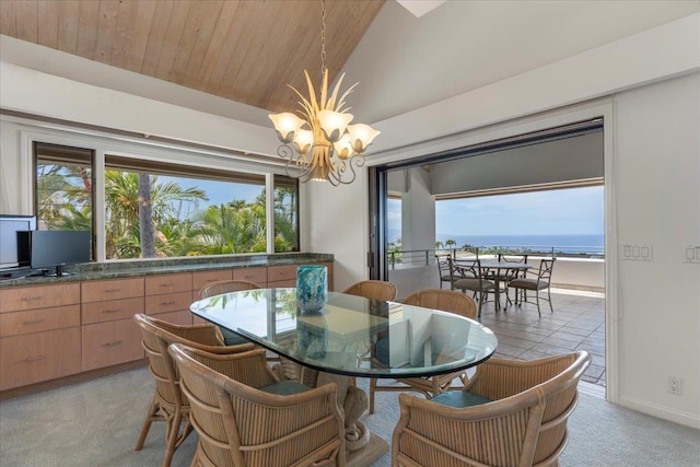 carpeted dining area featuring a water view, vaulted ceiling, a notable chandelier, and wood ceiling