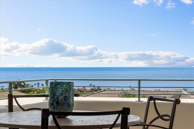 balcony featuring a water view