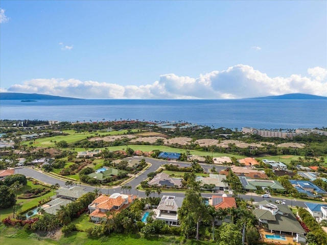 drone / aerial view featuring a water and mountain view