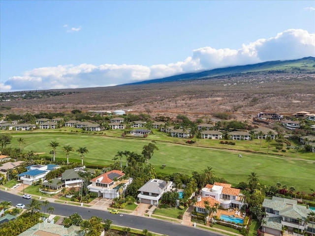 birds eye view of property with a mountain view