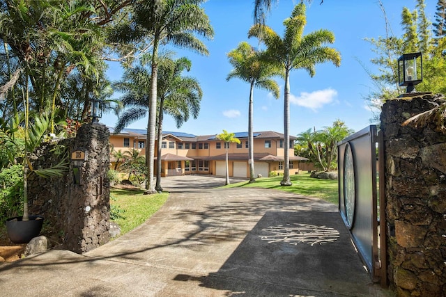 view of road with driveway and a gated entry