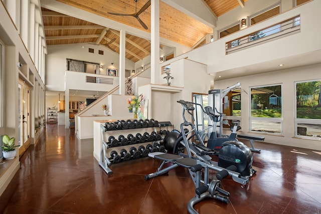 exercise room with wood ceiling and high vaulted ceiling