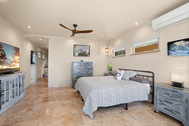 bedroom with ceiling fan, baseboards, an AC wall unit, and recessed lighting