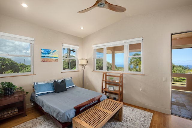 bedroom featuring lofted ceiling, recessed lighting, wood finished floors, baseboards, and access to outside