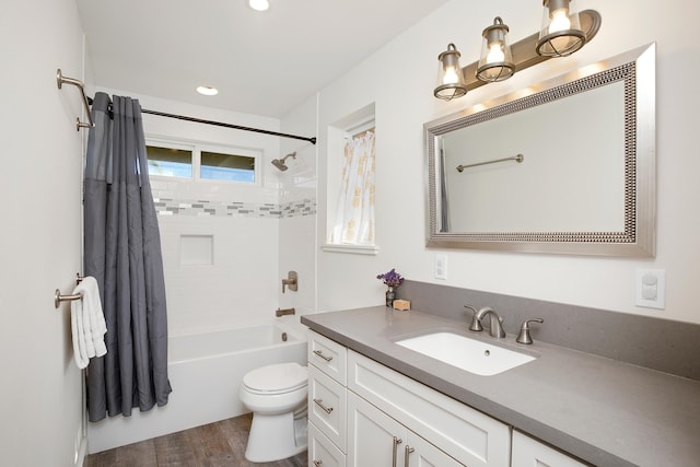 full bath featuring toilet, shower / tub combination, wood finished floors, and vanity