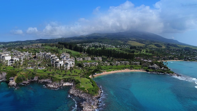 drone / aerial view with a water and mountain view