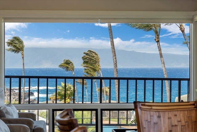 balcony with a water and mountain view