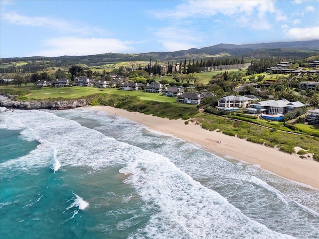 birds eye view of property with a beach view and a water view