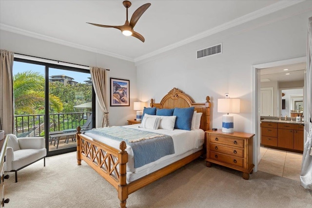 bedroom with visible vents, crown molding, light colored carpet, access to outside, and a sink