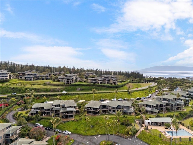 bird's eye view with a residential view and a water view