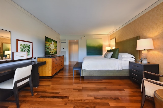 bedroom featuring dark hardwood / wood-style flooring and ornamental molding