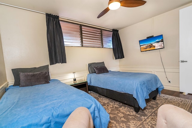 bedroom featuring ceiling fan and dark wood-type flooring