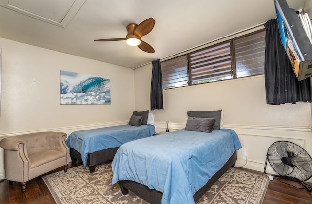 bedroom featuring dark hardwood / wood-style floors and ceiling fan