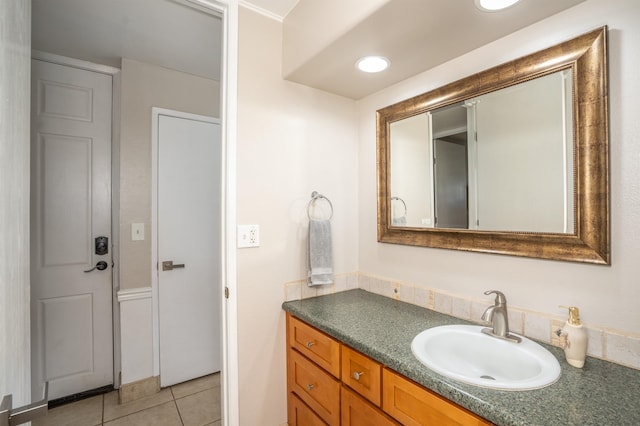 bathroom featuring vanity with extensive cabinet space and tile flooring