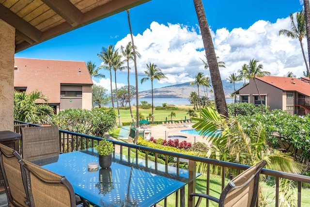 balcony featuring a water view