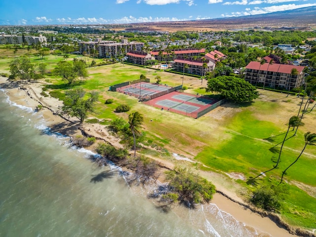 birds eye view of property with a view of the beach and a water view