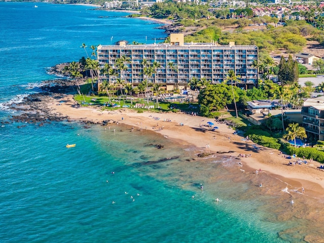 aerial view with a water view and a beach view