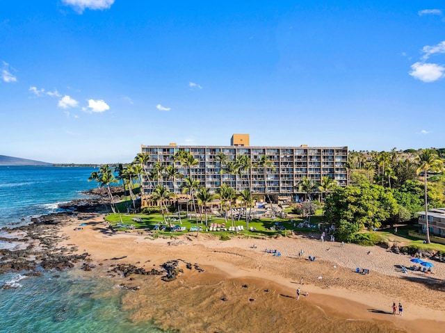 birds eye view of property with a water view and a view of the beach