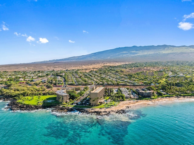 aerial view featuring a water and mountain view