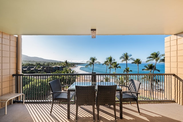 balcony with a water and mountain view