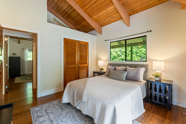 bedroom featuring a closet, wood ceiling, vaulted ceiling with beams, and dark hardwood / wood-style flooring