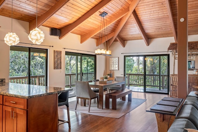 dining room featuring plenty of natural light, an inviting chandelier, and light wood-type flooring